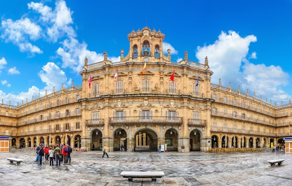 Famous and historic  Plaza Mayor in Salamanca on a sunny day with dramatic clouds, Castilla y Leon, Spain